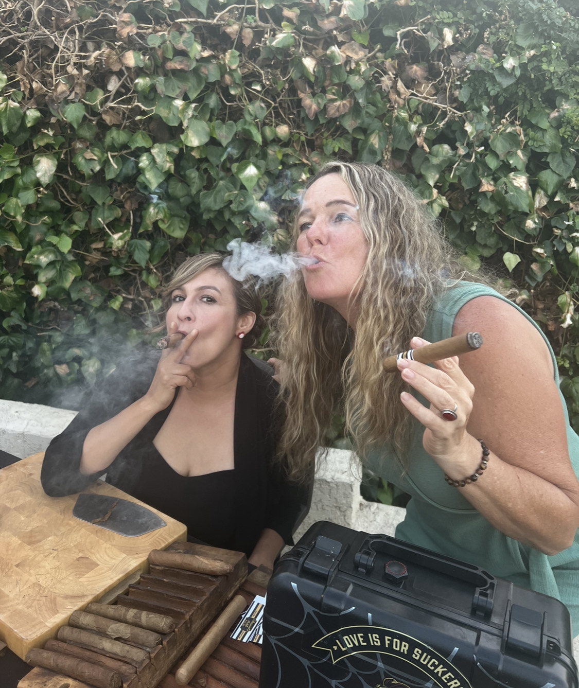 Guests enjoying hand-rolled cigars at a Cigar Nights event
